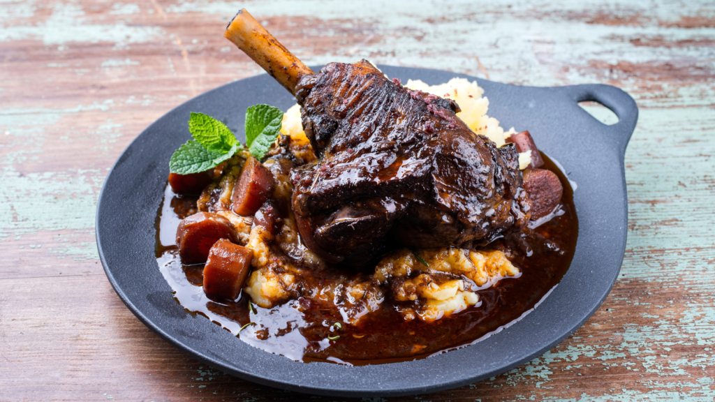 Braised lamb shanks with red wine and herbs